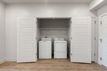 White laundry room with washer and dryer